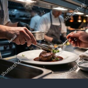 stock-photo-team-of-restaurant-chefs-collaborating-in-a-commercial-kitchen-to-prepare-and-plate-a-gourmet-dish-2723216705